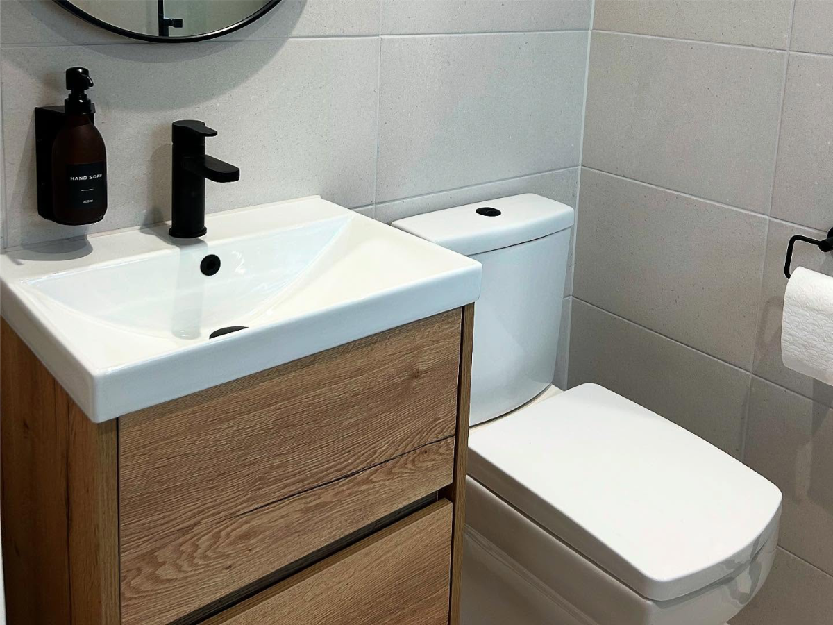 Oak vanity unit, basin and toilet fitted in Corringham, Essex