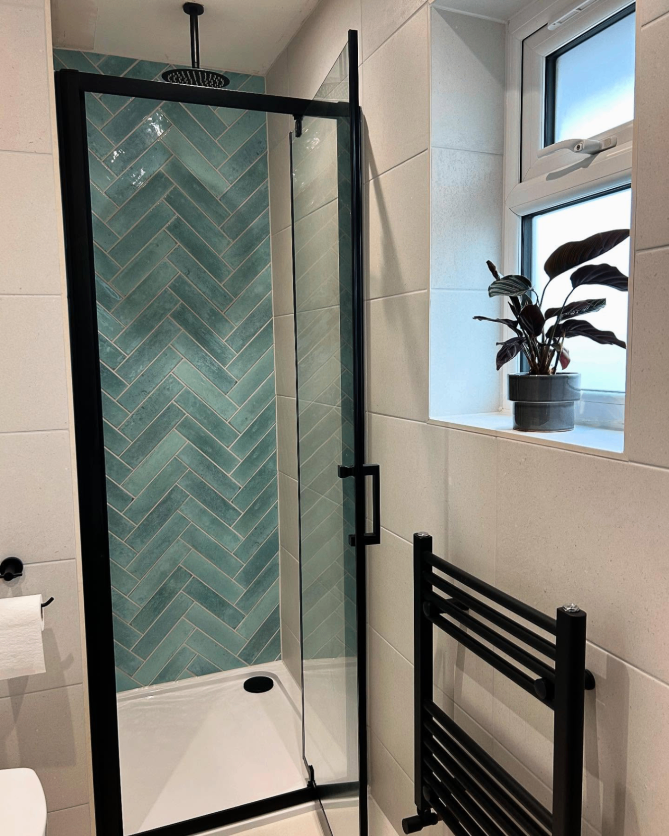 Turquoise herringbone tiled shower installation in Corringham, Essex by Plumbers ESX
