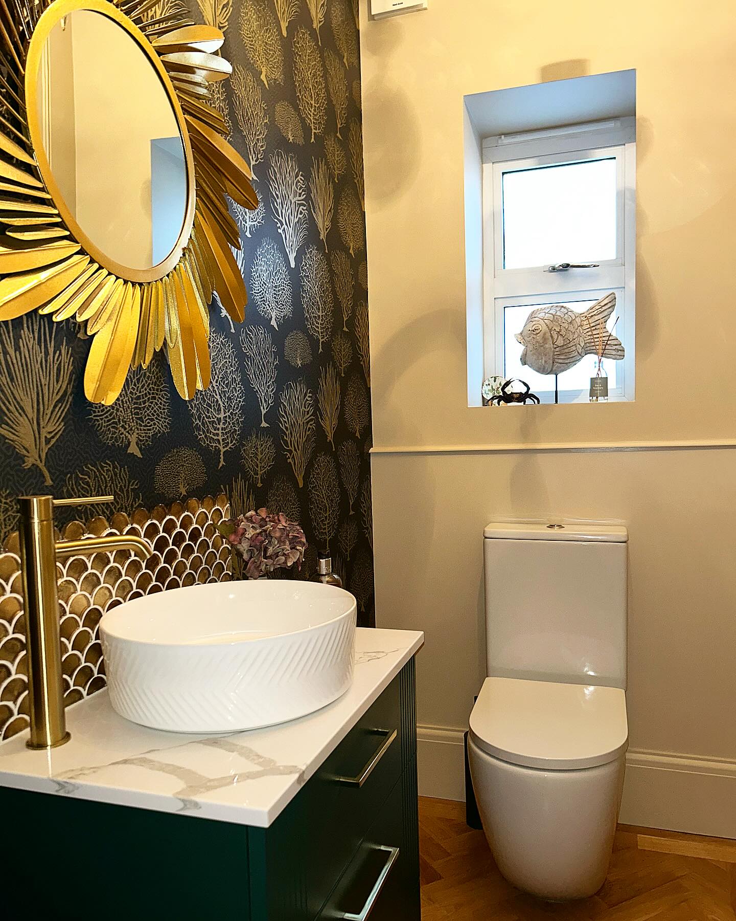 Luxury cloakroom installation with vessel basin and patterned wallpaper in Essex