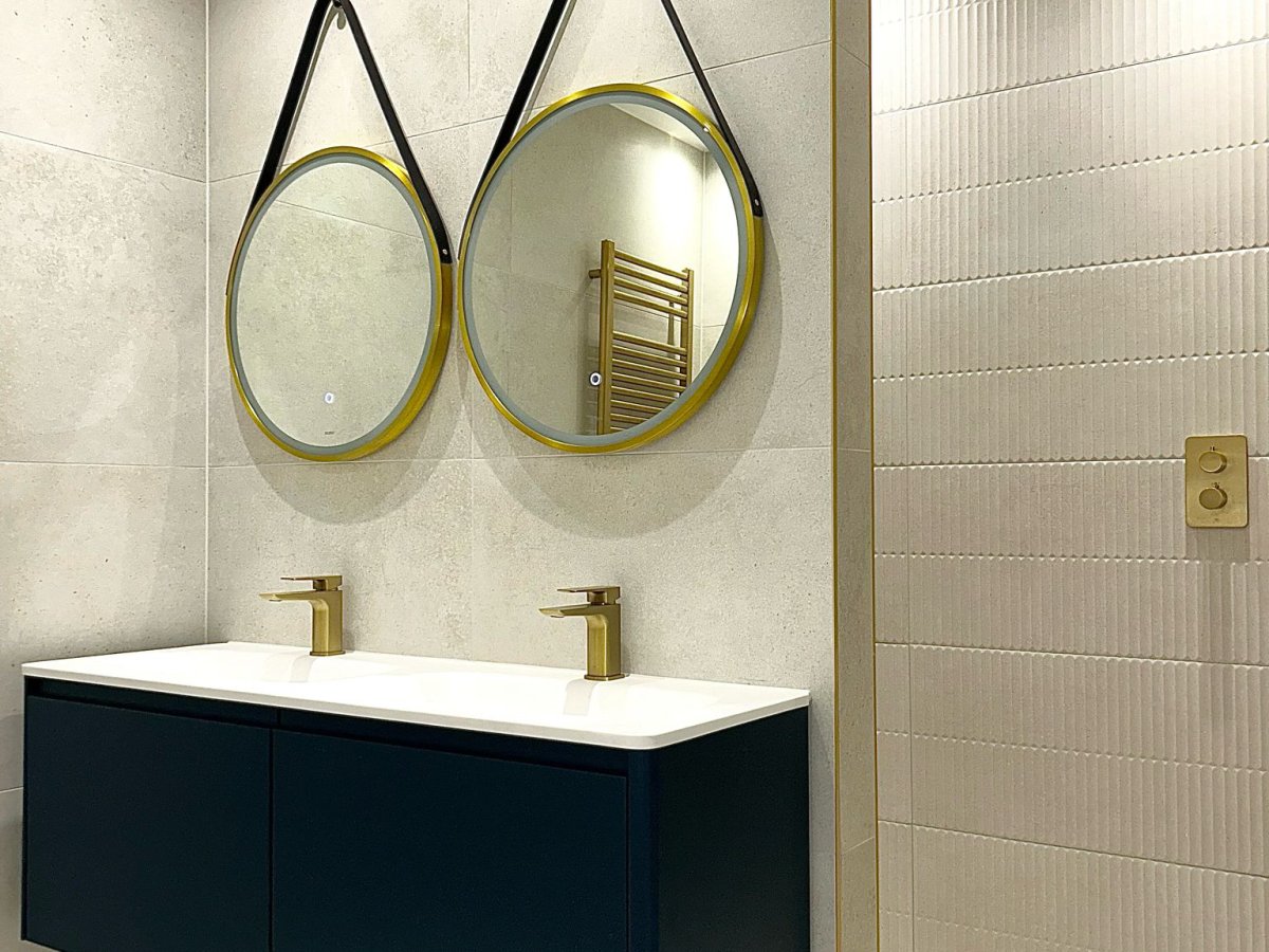 Navy and brass bathroom renovation by Plumbers ESX in Essex